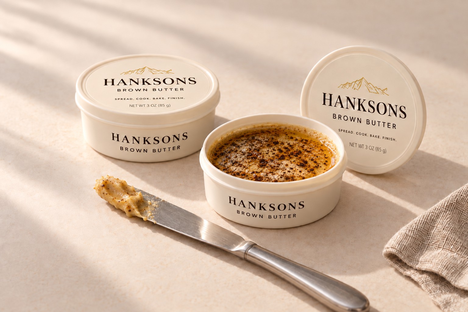 HANKSONS Brown Butter packaging illustration with open butter and a serving knife